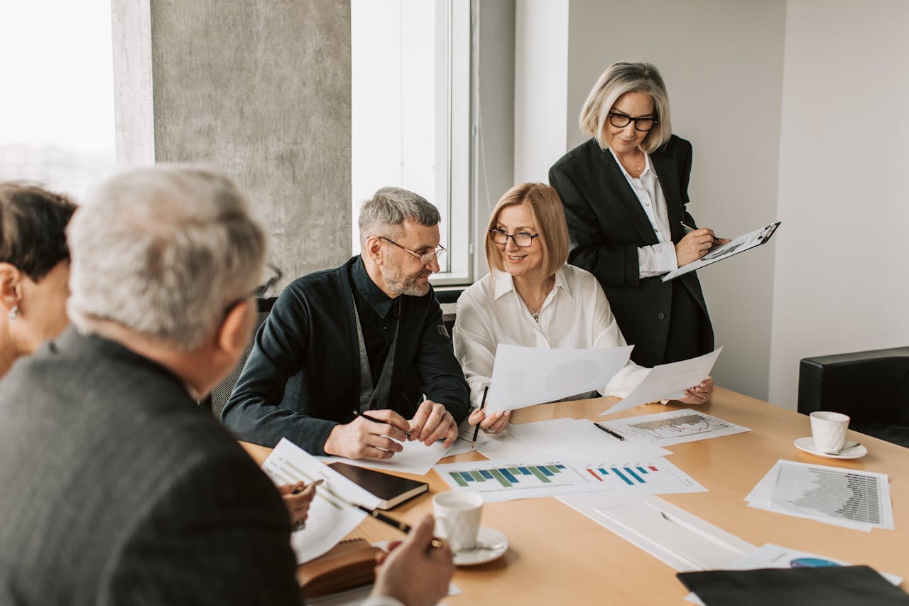 A diverse group of business professionals engaged in a strategic meeting.